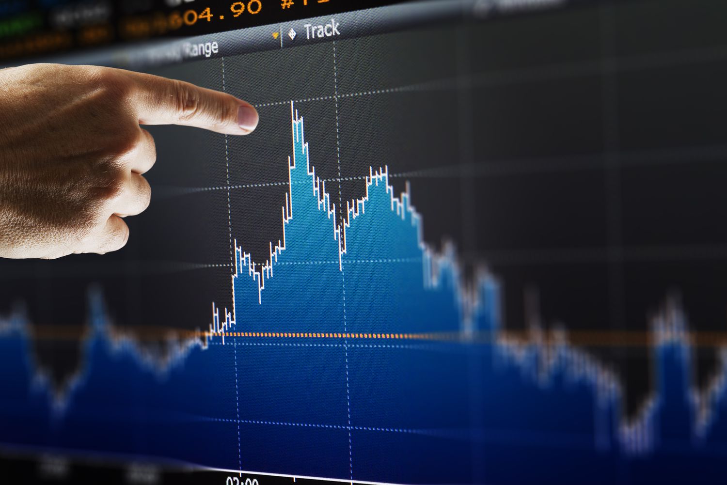 trader pointing chart screen